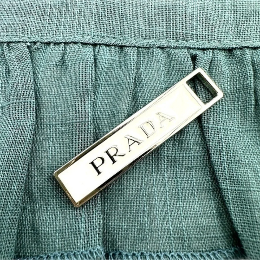 Prada charm w/bonus gift. AUTHENTIC White and silver.