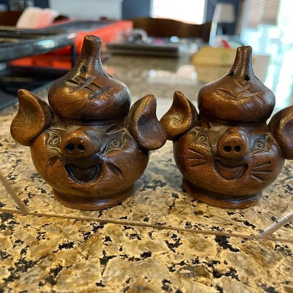 Vintage carved pig salt and pepper shakers