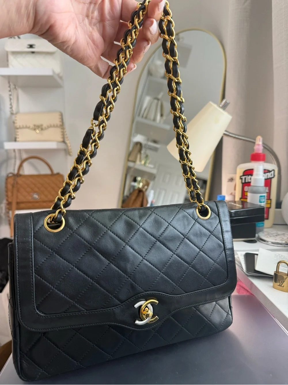 CHANEL Black Quilted Leather Shoulder Bag with Gold Chain Strap