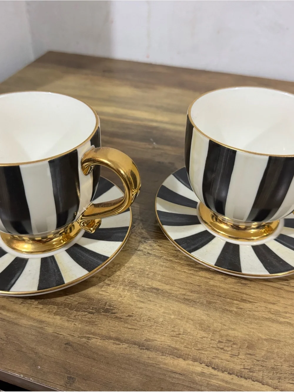 MacKenzie-Childs Black and White Striped Gold-Trim Teacup and Saucer Set pair