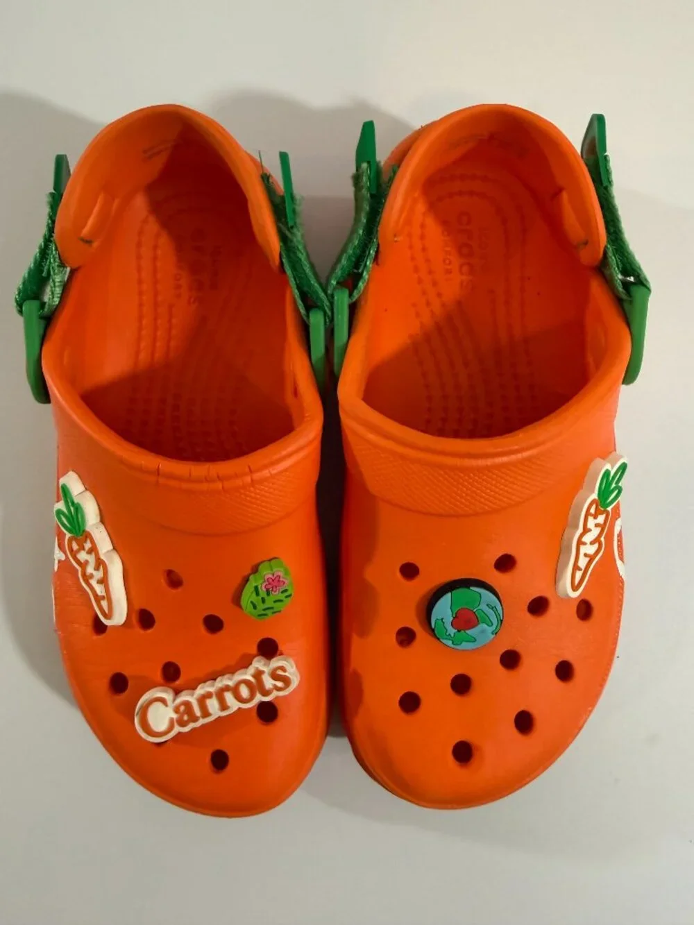 Crocs Carrots clogs with green straps & Croc charms size 1 Junior- gently used