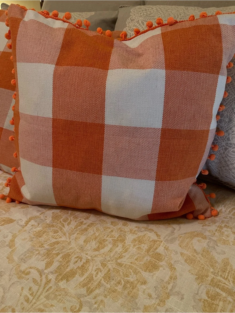 Orange Buffalo Check Decorative Throw Pillows with Pom Trim (x 4)