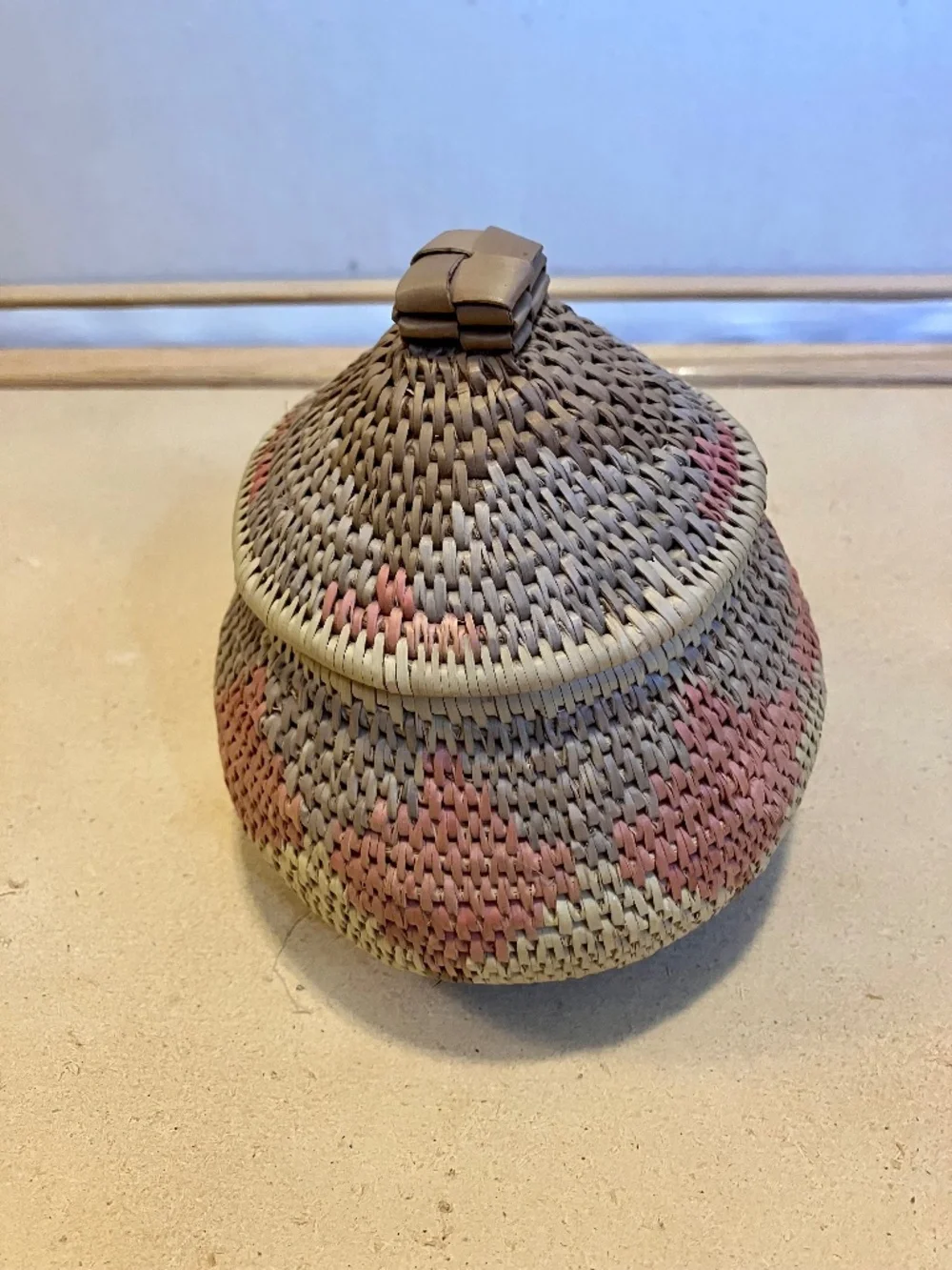 Hand-woven basket with lid