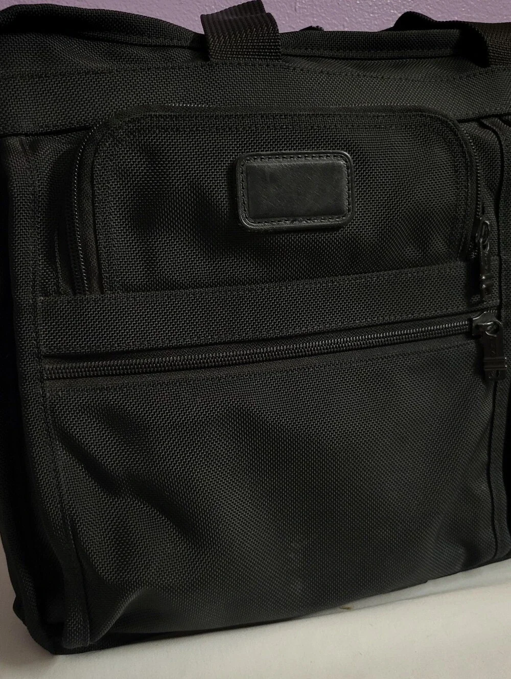 Tumi zip purchase no