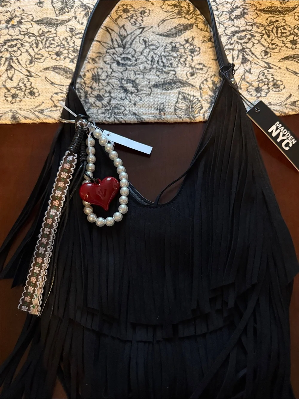 Madden NYC Black Fringe Hobo Bag with Pearl & Heart Charm