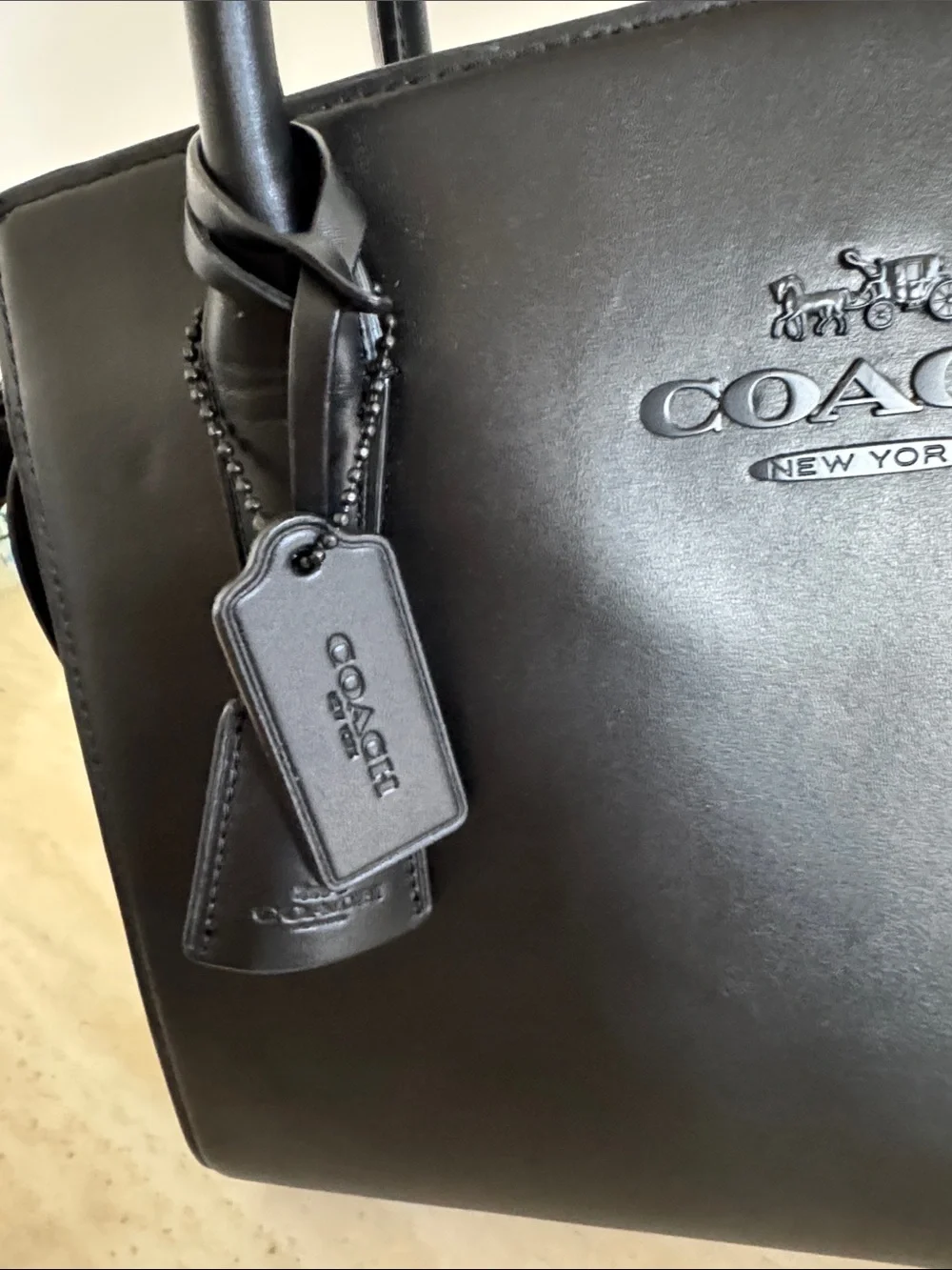 Coach sleek black