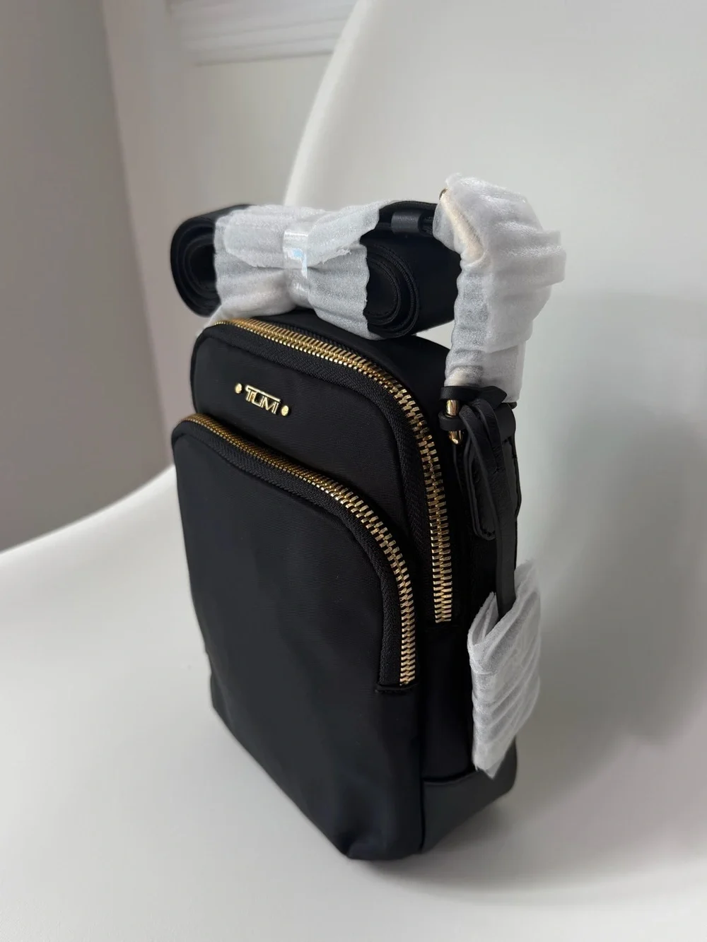 Tumi compact crossbody