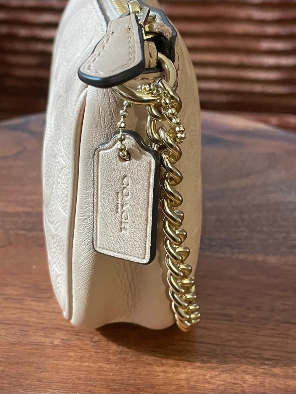 Coach ivory embossed