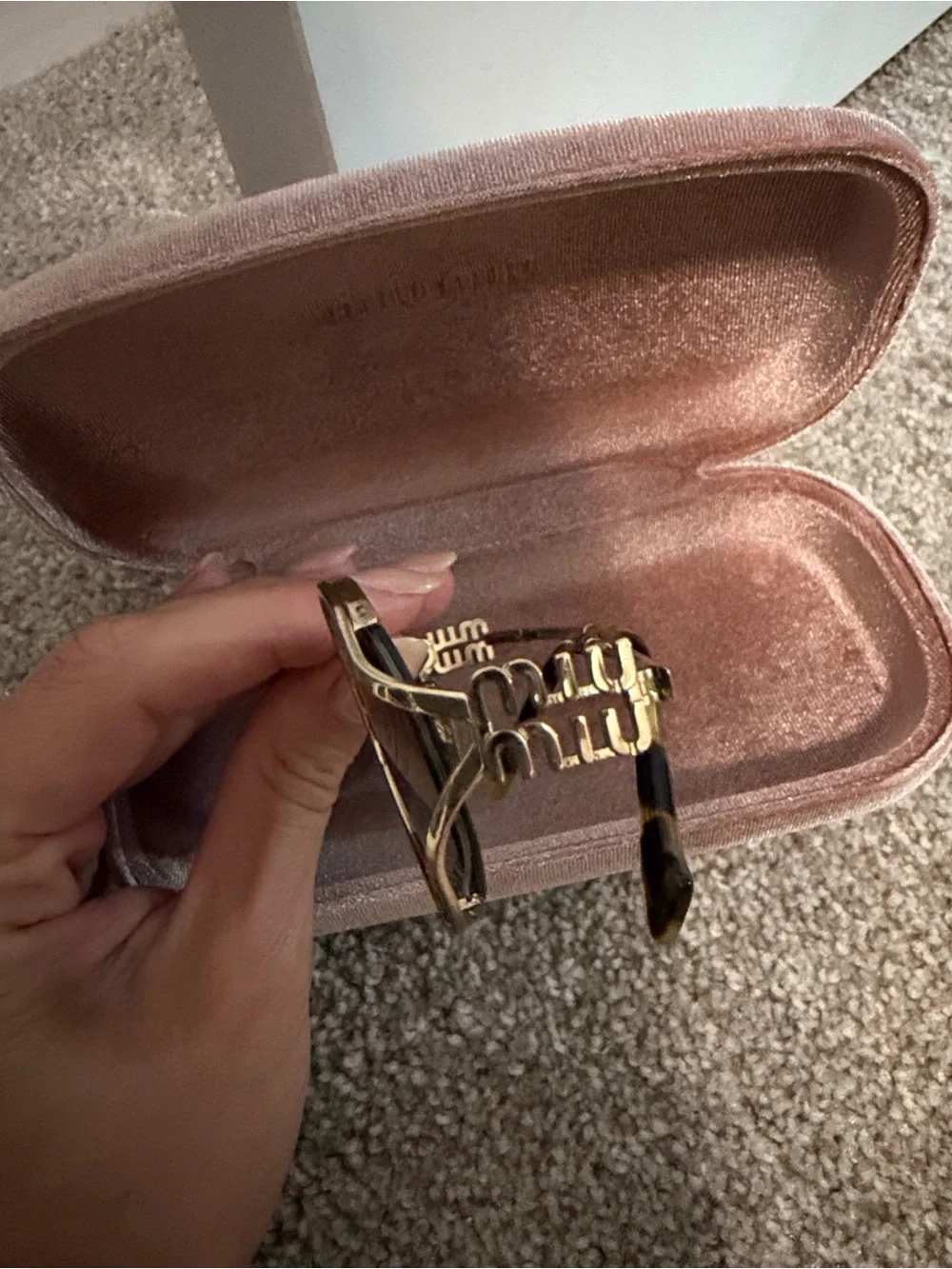 Miu Miu Oval Sunglasses