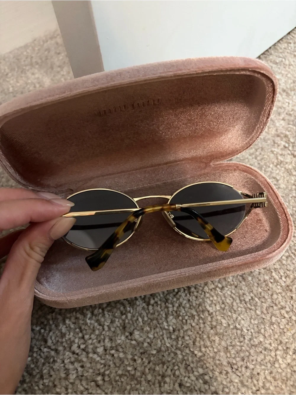 Miu Miu Oval Sunglasses