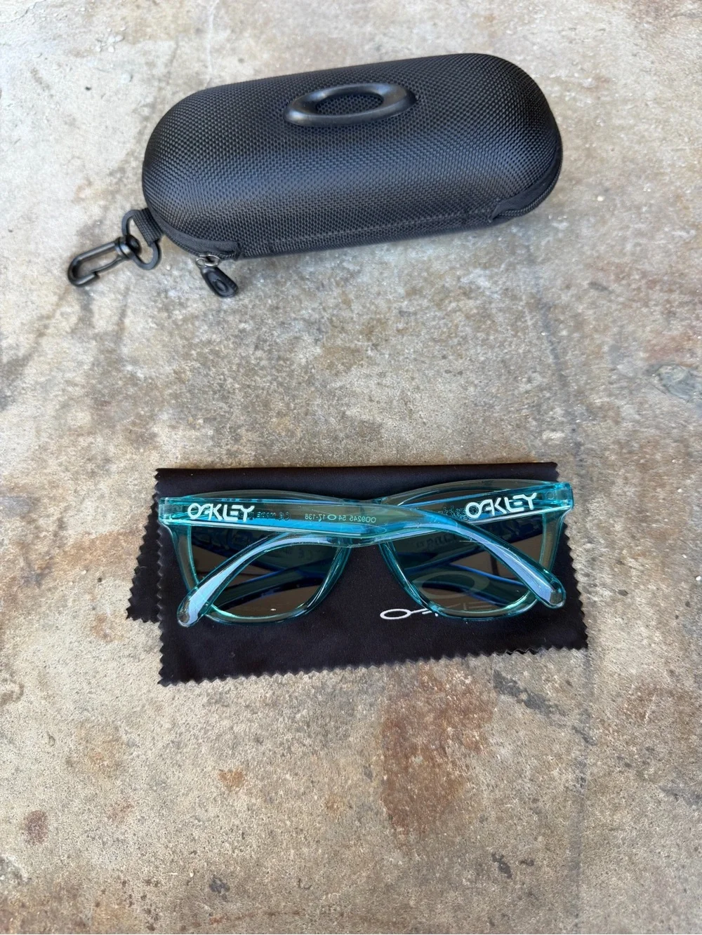 Oakley Teal Translucent Frame Sunglasses with Vibrant Blue Polarized Lenses