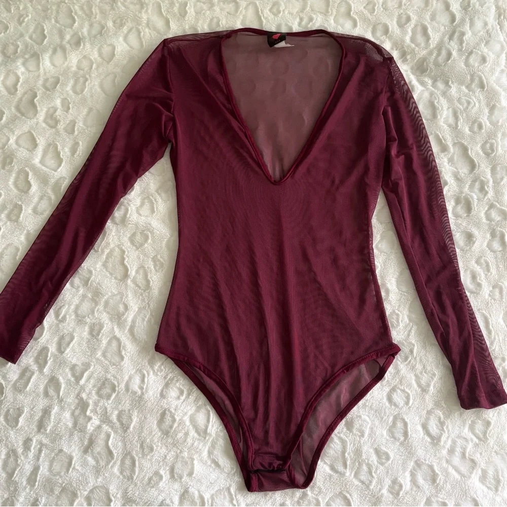 NWOT USA Vintage Burgundy Sheer Long Sleeve Bodysuit in Size Medium.
