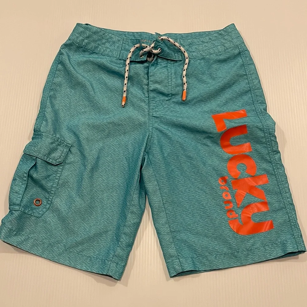 Lucky brand boys turquoise swim trunks, drawstring waist. Boys size 14