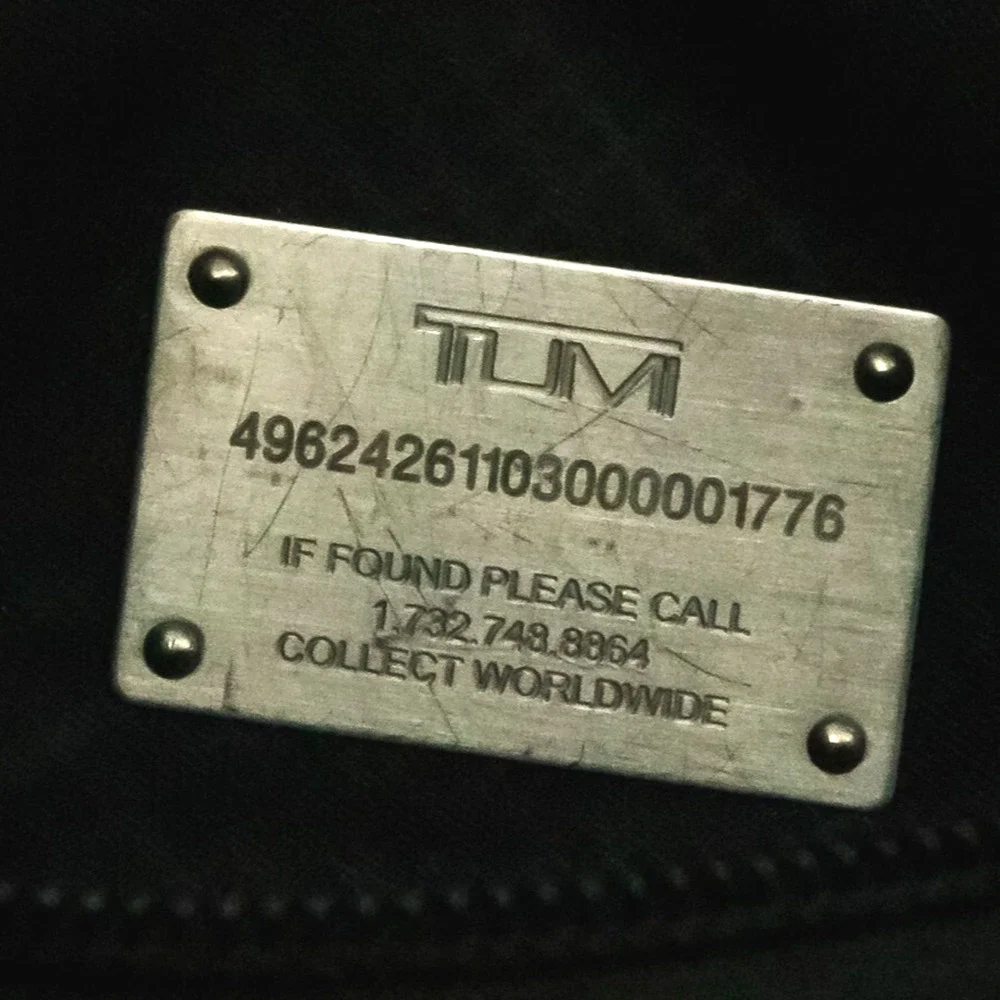 Tumi black leather