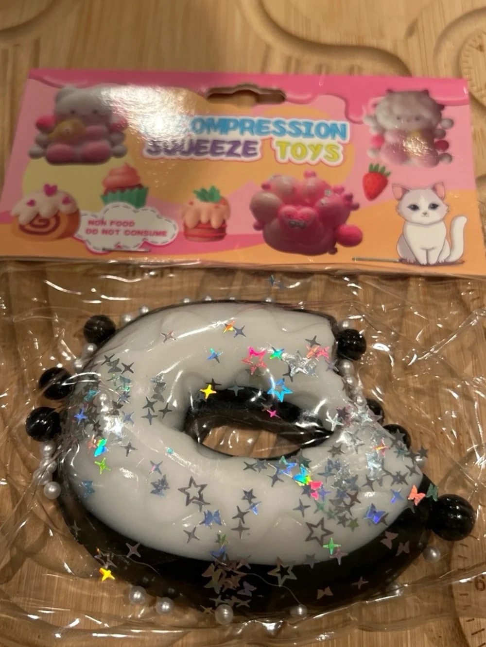 Kids Compression Squeeze Toy - White & Black Donut with Star Glitter
