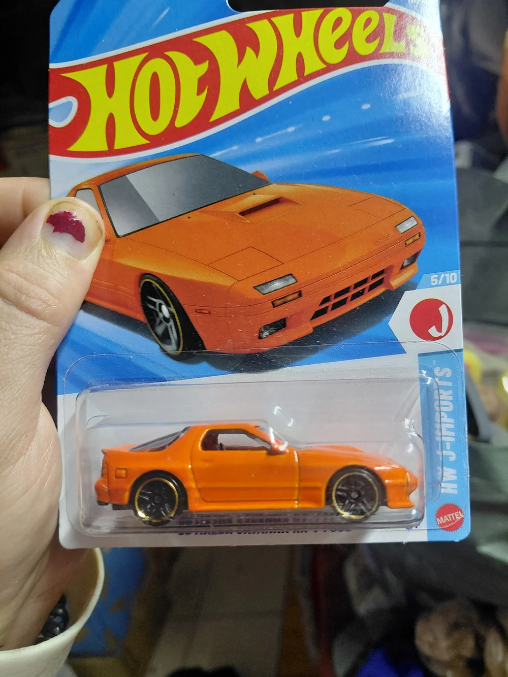 the Hot Wheels '89 Mazda Savanna RX-7 FC3S in orange, part of the 2026 HW J-Impo