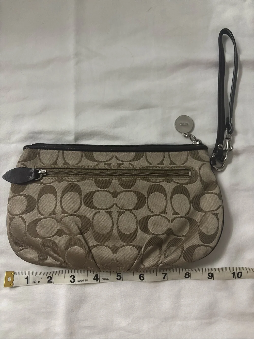 Coach wristlet featuring