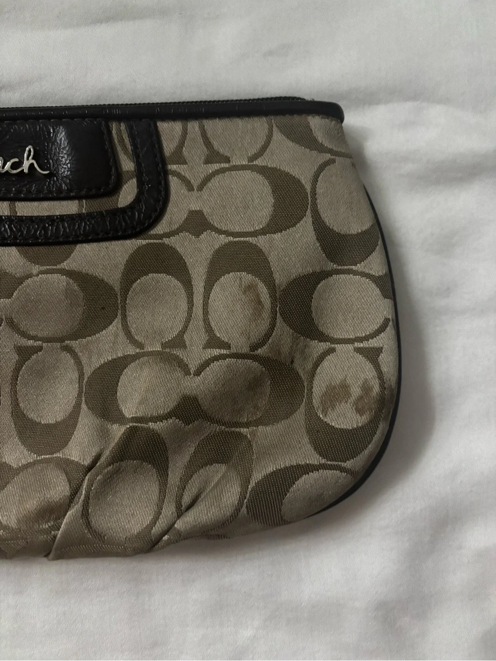 Coach wristlet featuring
