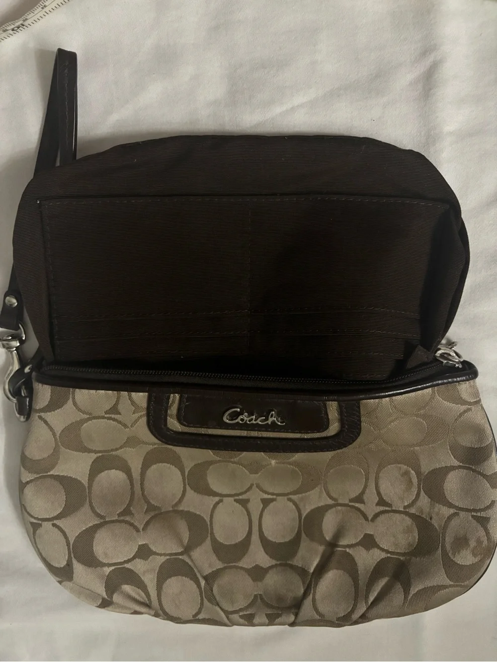Coach wristlet featuring