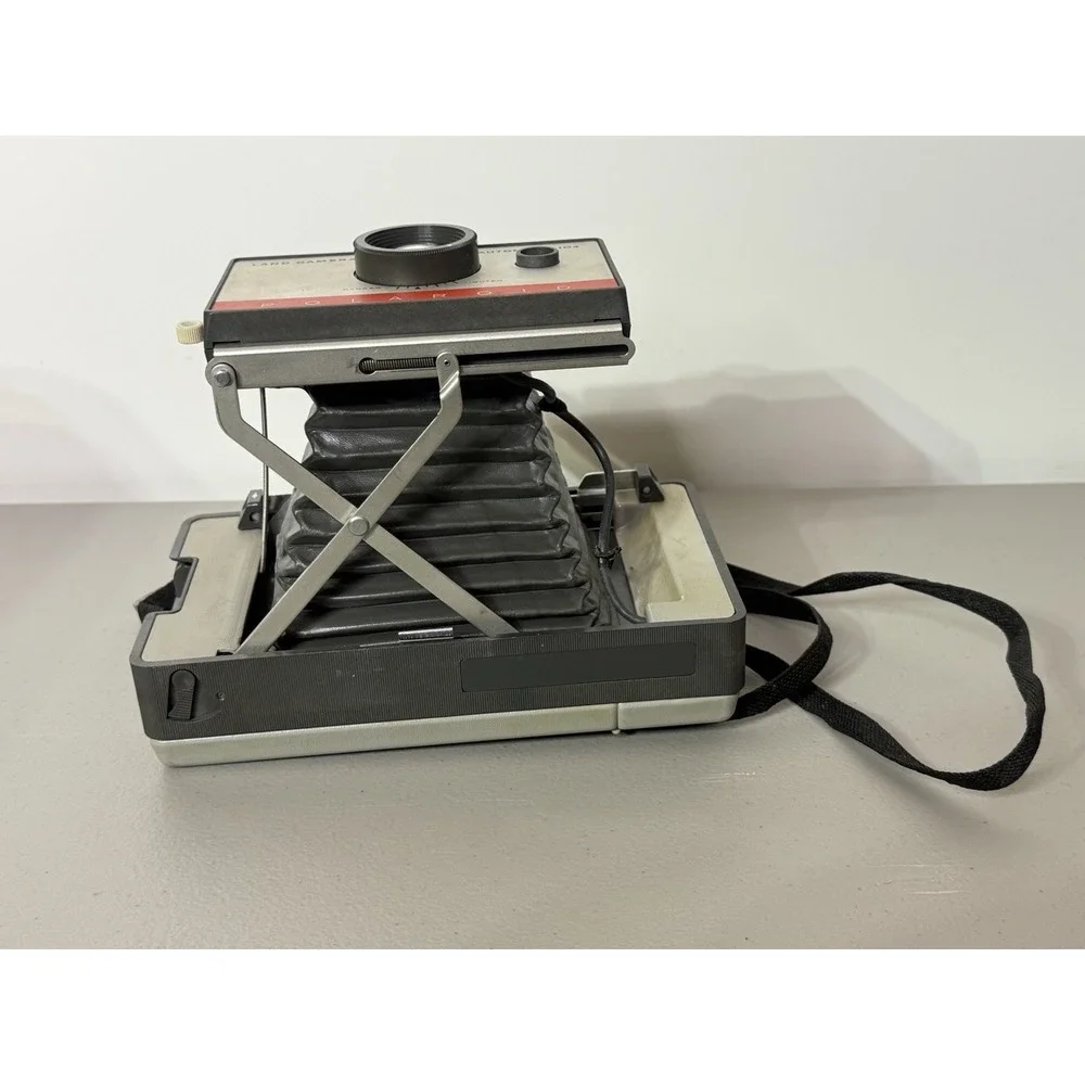 Polaroid camera extends