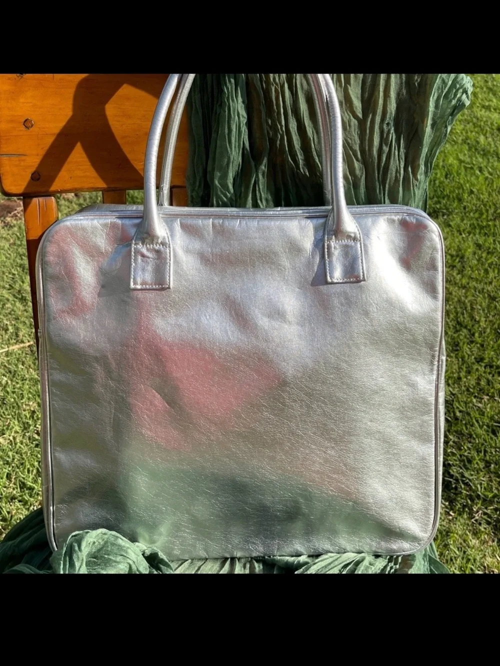 NWOT metallic silver laptop bag. Silver.    .
