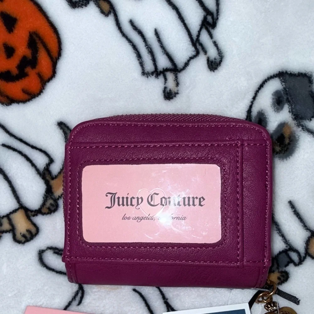 Juicy Couture stylish compact featuring