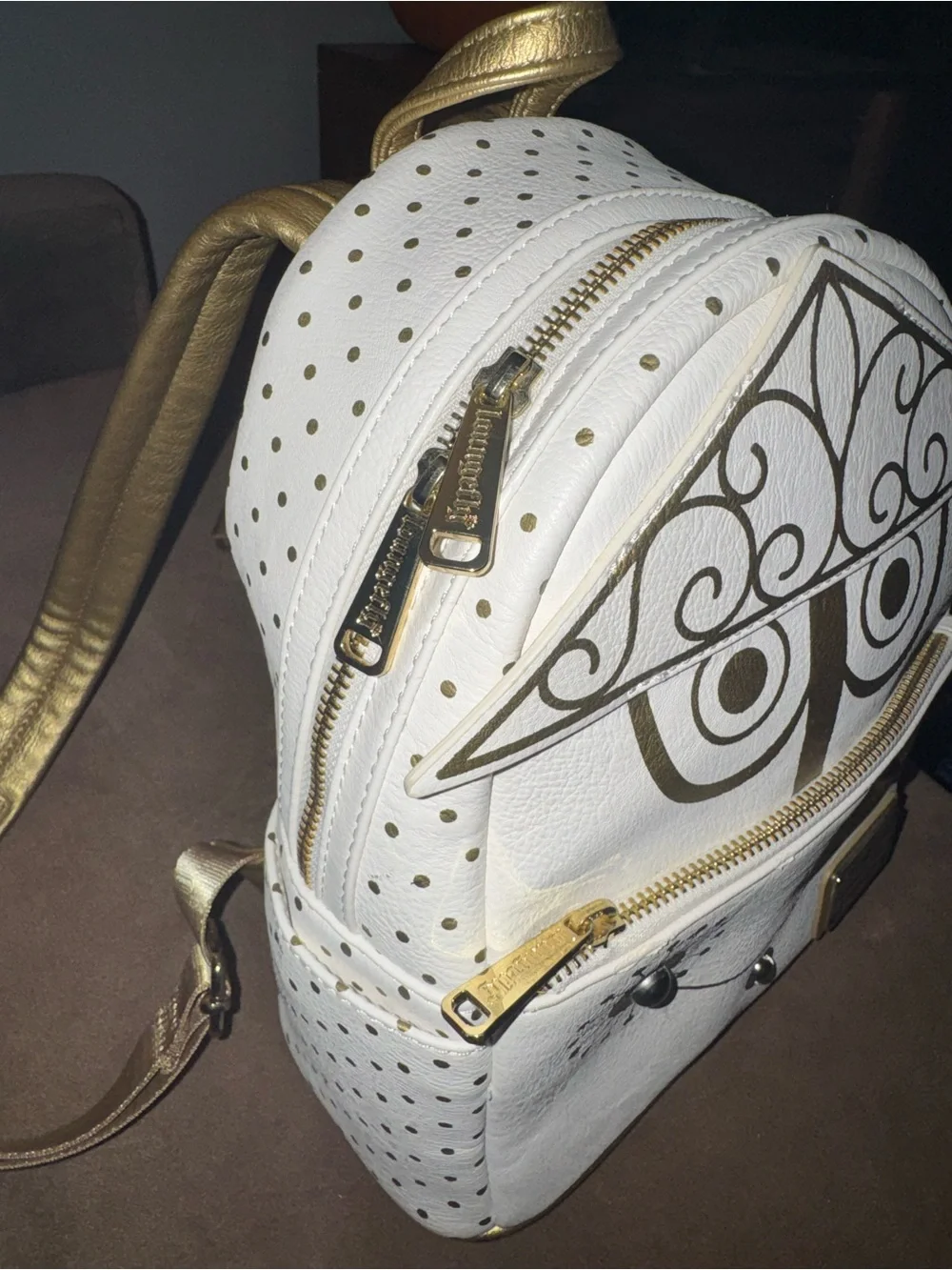 Loungefly White & Gold Mini Backpack with Decorative Face Motif