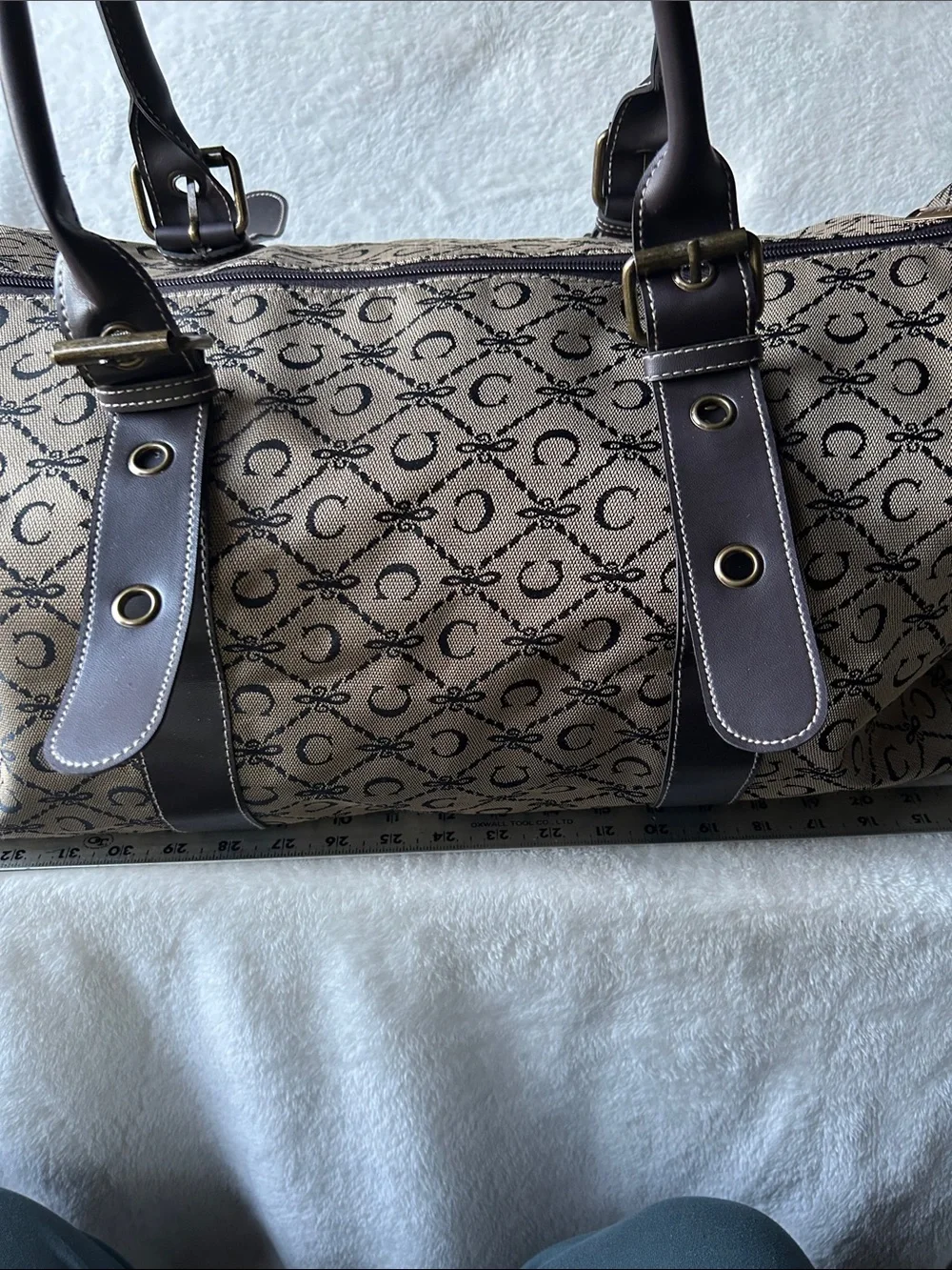 CIAO! 22” duffle bag with faux leather handles buckle