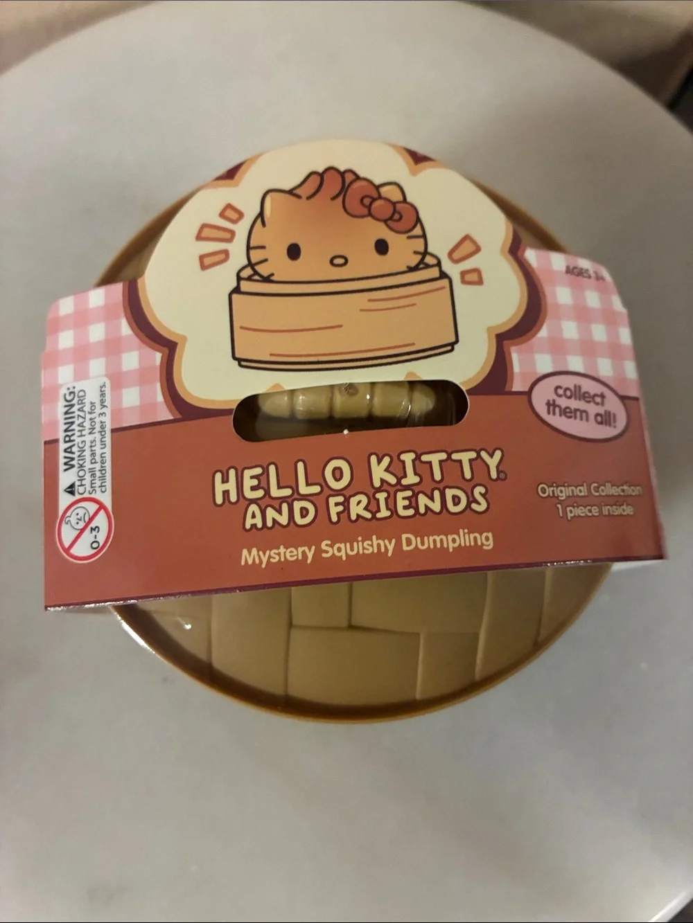 Hello Kitty and Friends Mystery Squishy Dumpling - Tan & Pink Packaging