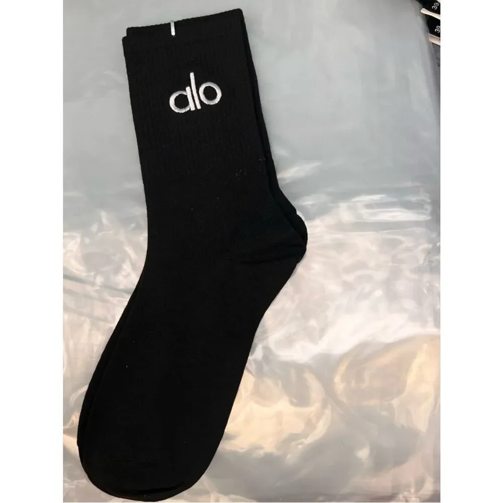 ALO Yoga unisex half crew understated socks in gray embroidered logo