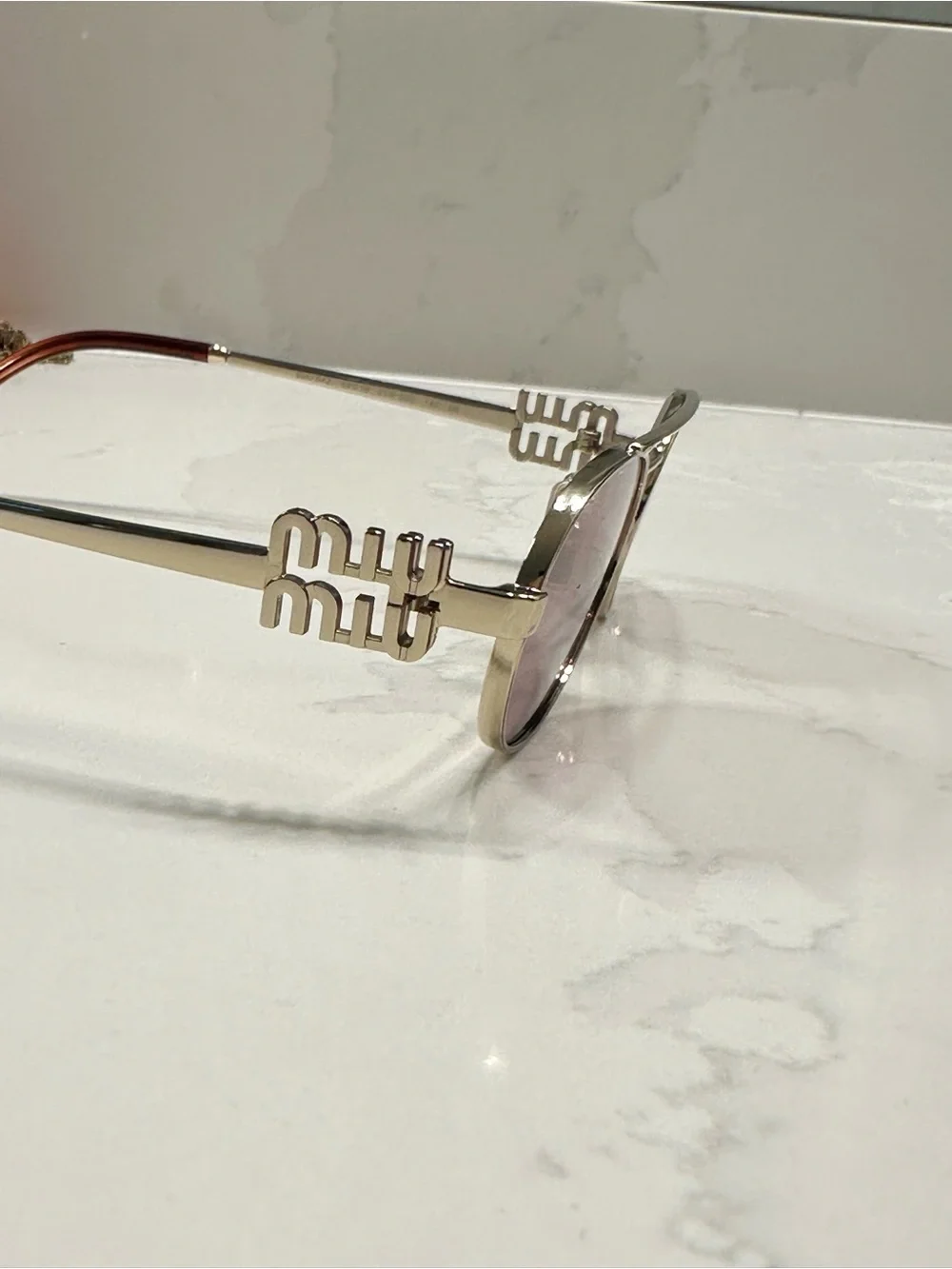 Miu Miu elegant gold