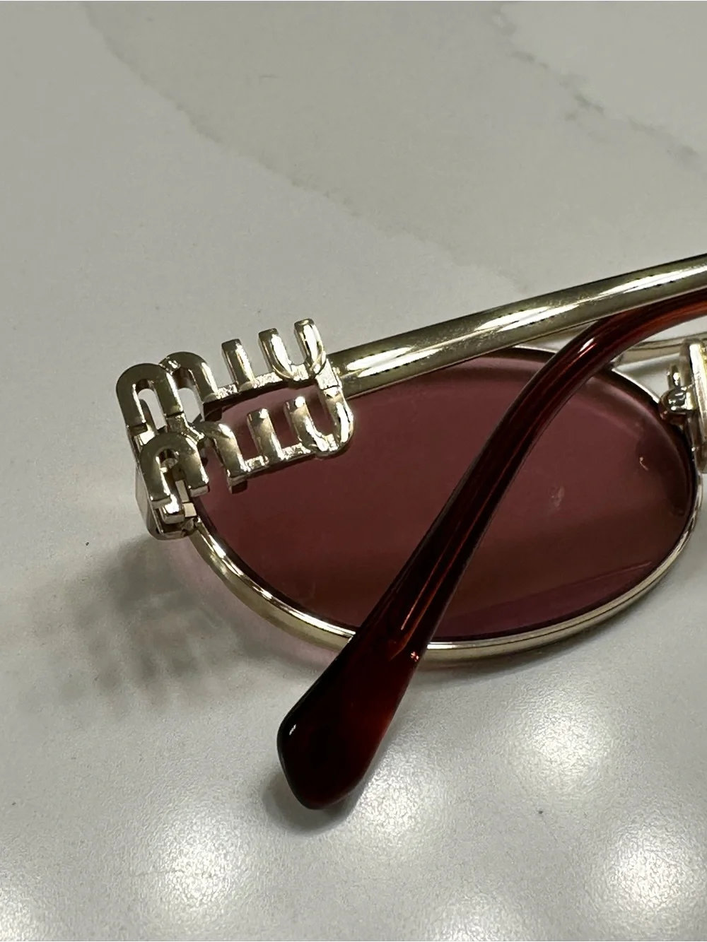 Miu Miu elegant gold