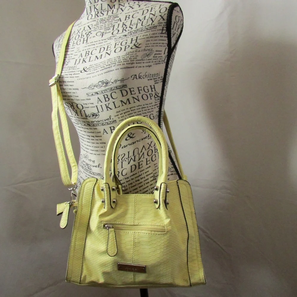 Nicole Miller shoulder includes