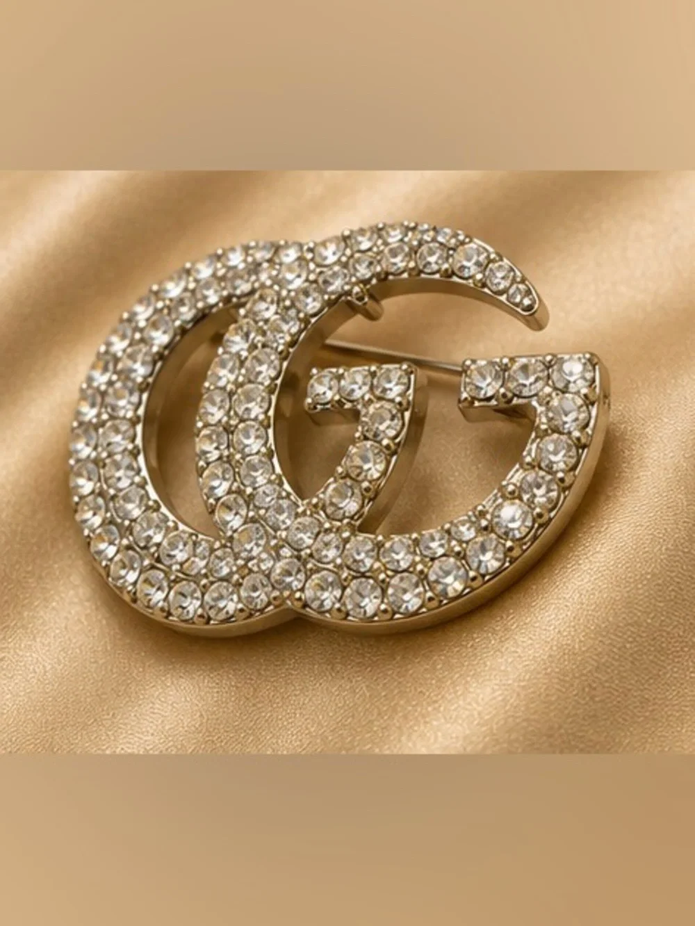 Gold Tone Rhinestone Interlocking Letter Statement Brooch Pin