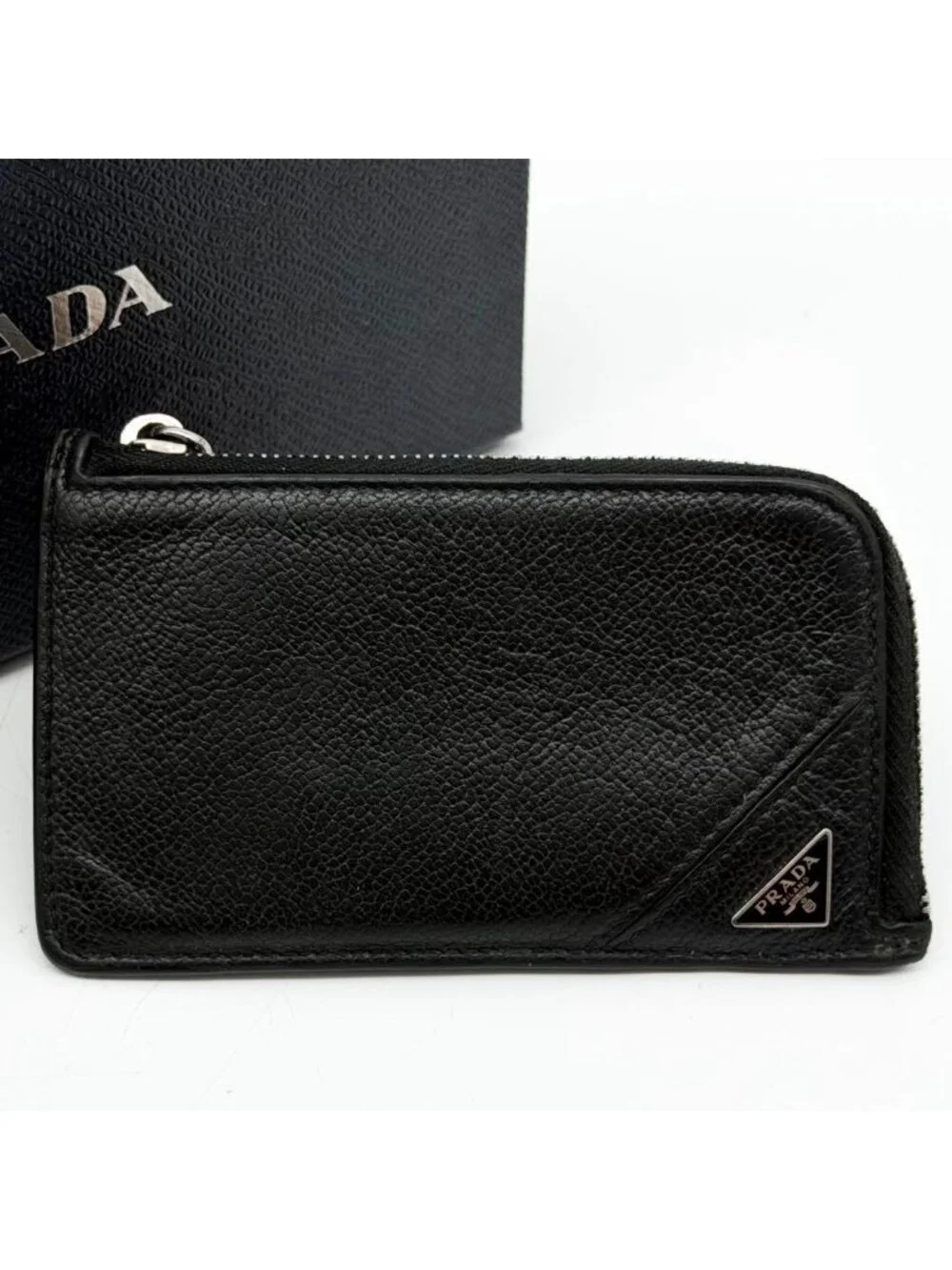 Prada brand triangle