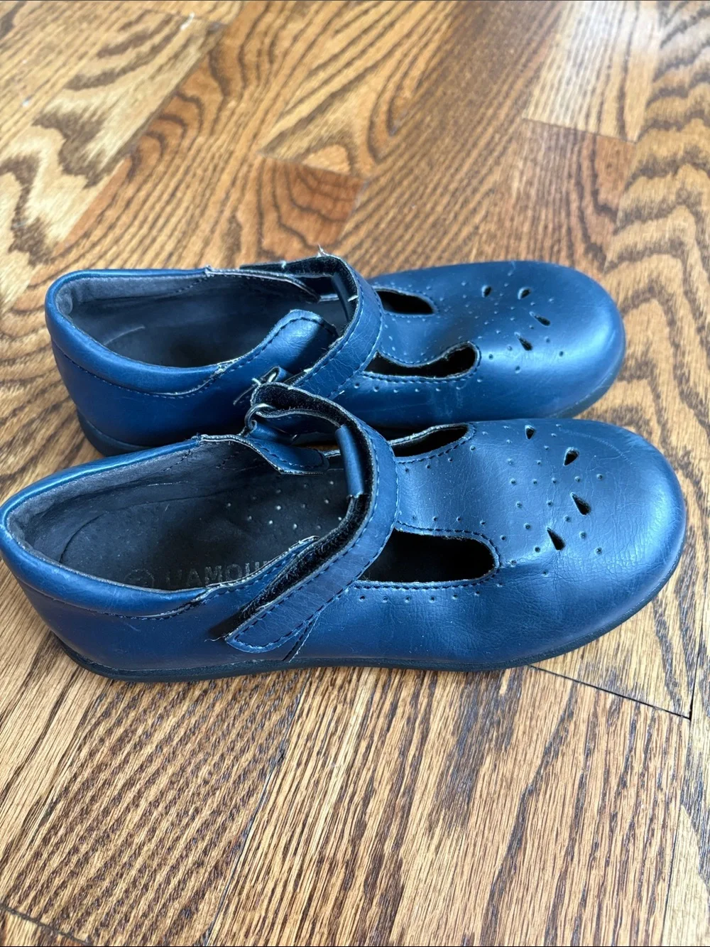 L'Amour girls navy blue with cutout pattern t-strap Mary Jane shoes, size 11.