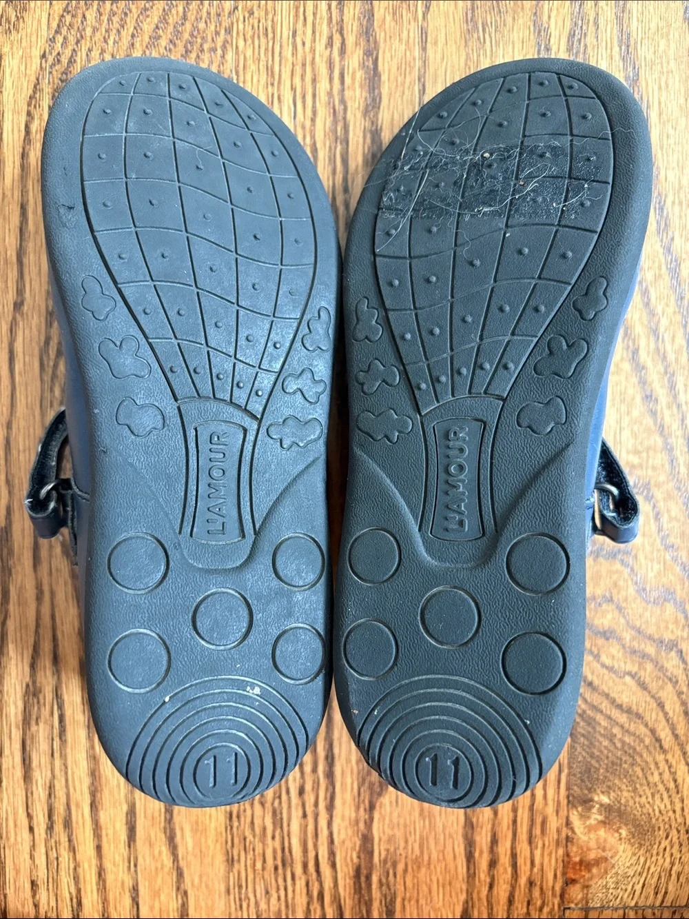 L'Amour girls navy blue with cutout pattern t-strap Mary Jane shoes, size 11.