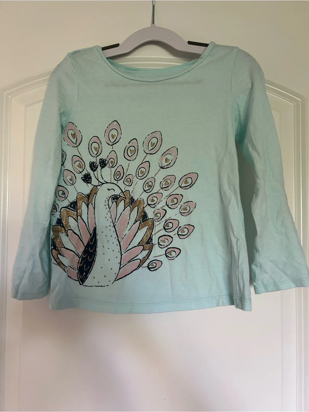 Girls Light Blue long Sleeve Top with Peacock Graphic
