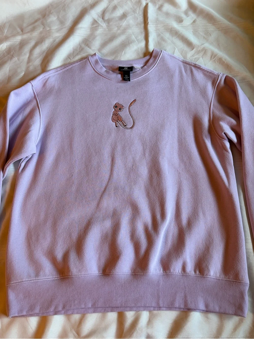 Pokémon Mew H&M Lavender Crewneck Sweater with Embroidered Cat Motif