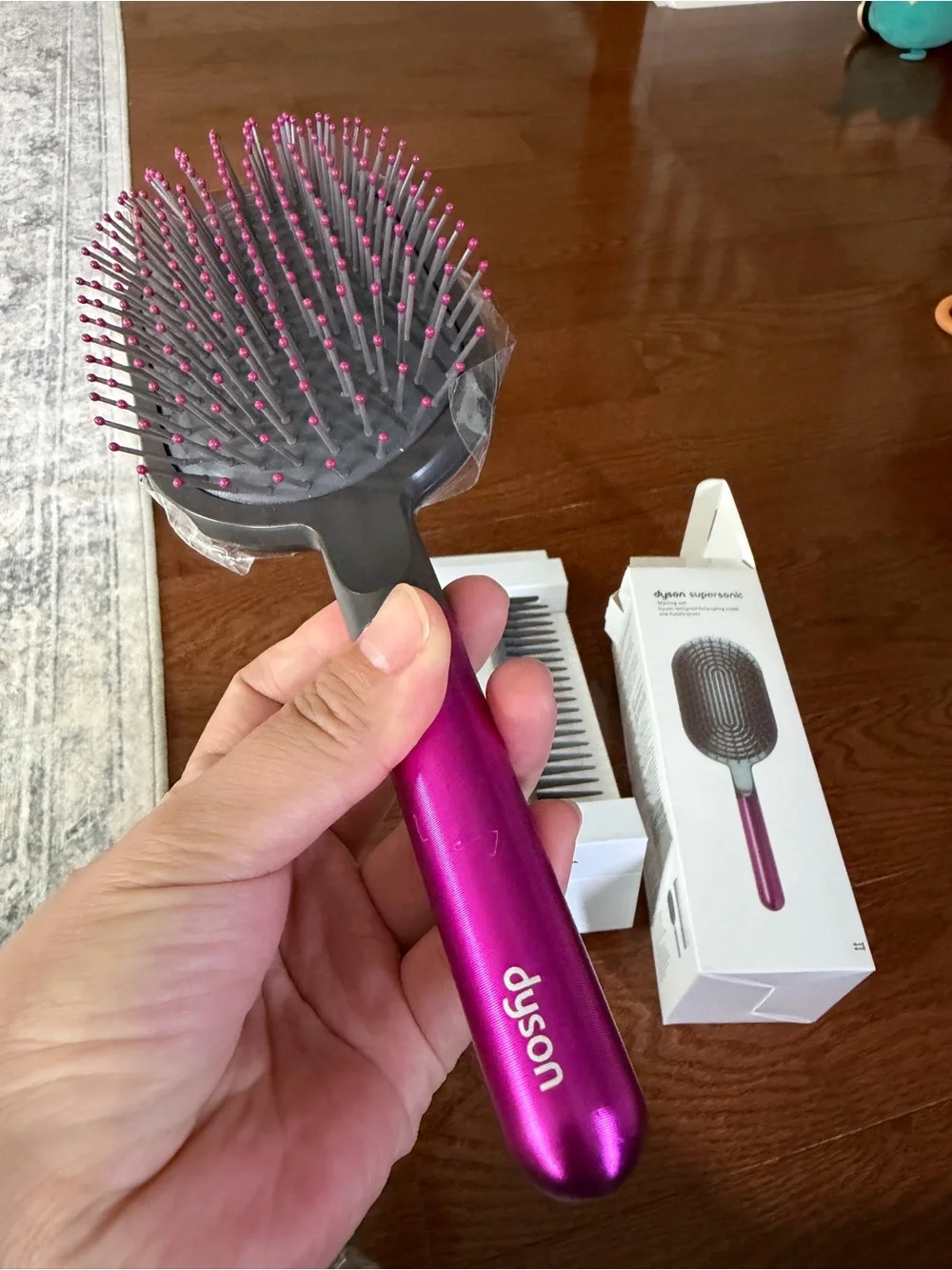 Dyson pink paddle brush with grey cushion